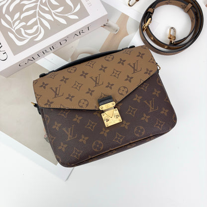 Louis Vuitton Pochette Métis, Reverse Monogram Canvas, Gold-tone S-Lock Hardware